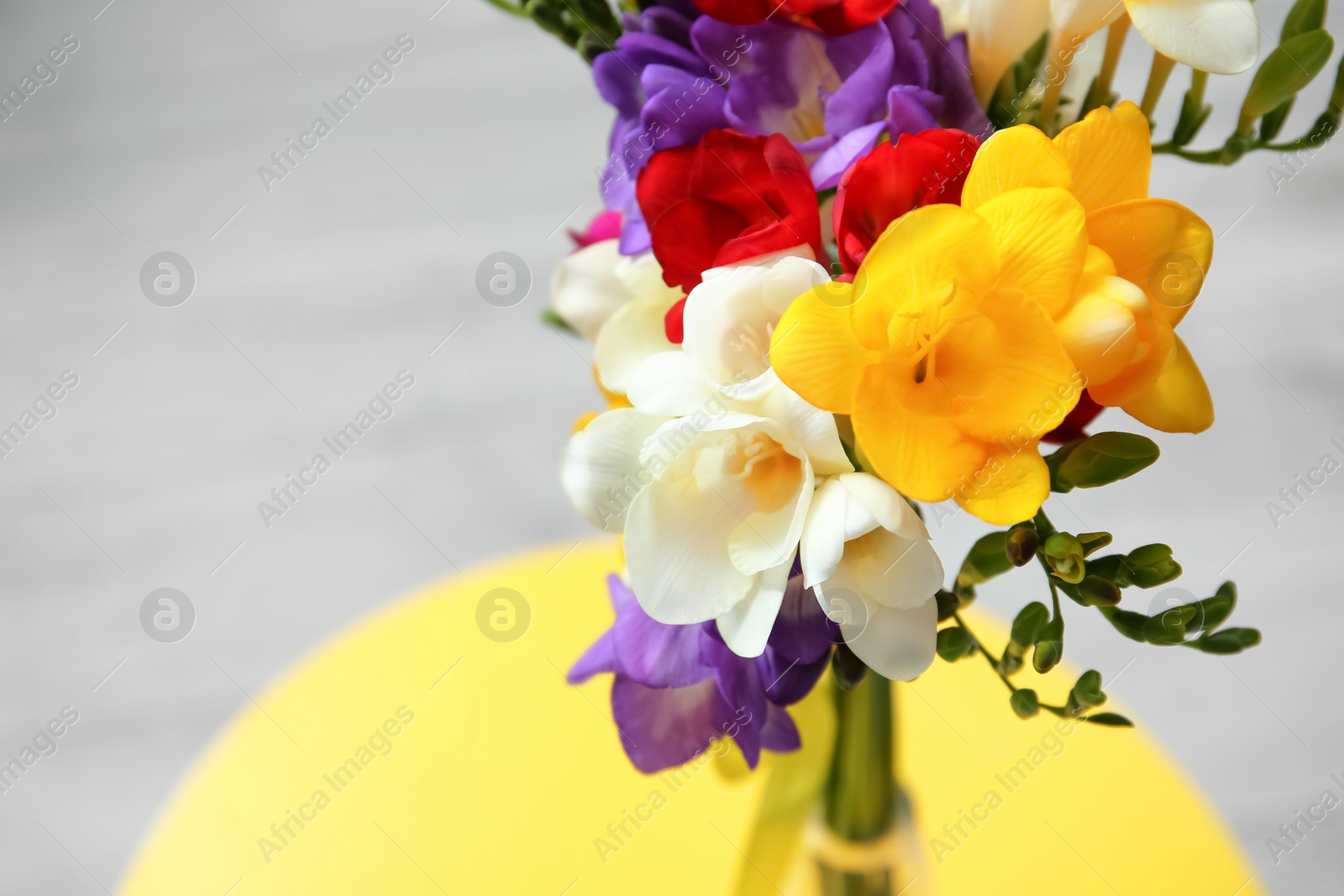 Photo of Beautiful freesia bouquet on table