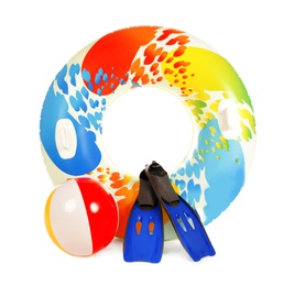 Photo of Bright inflatable ring, beach ball and flippers on white background
