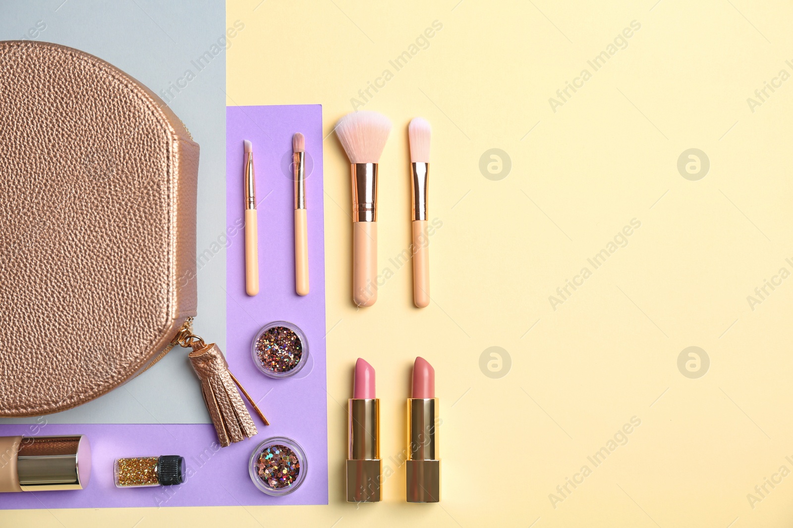 Photo of Flat lay composition with cosmetic products and makeup brushes on color background