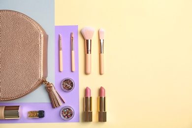 Photo of Flat lay composition with cosmetic products and makeup brushes on color background