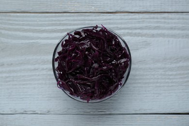 Photo of Tasty red cabbage sauerkraut on light grey wooden table, top view