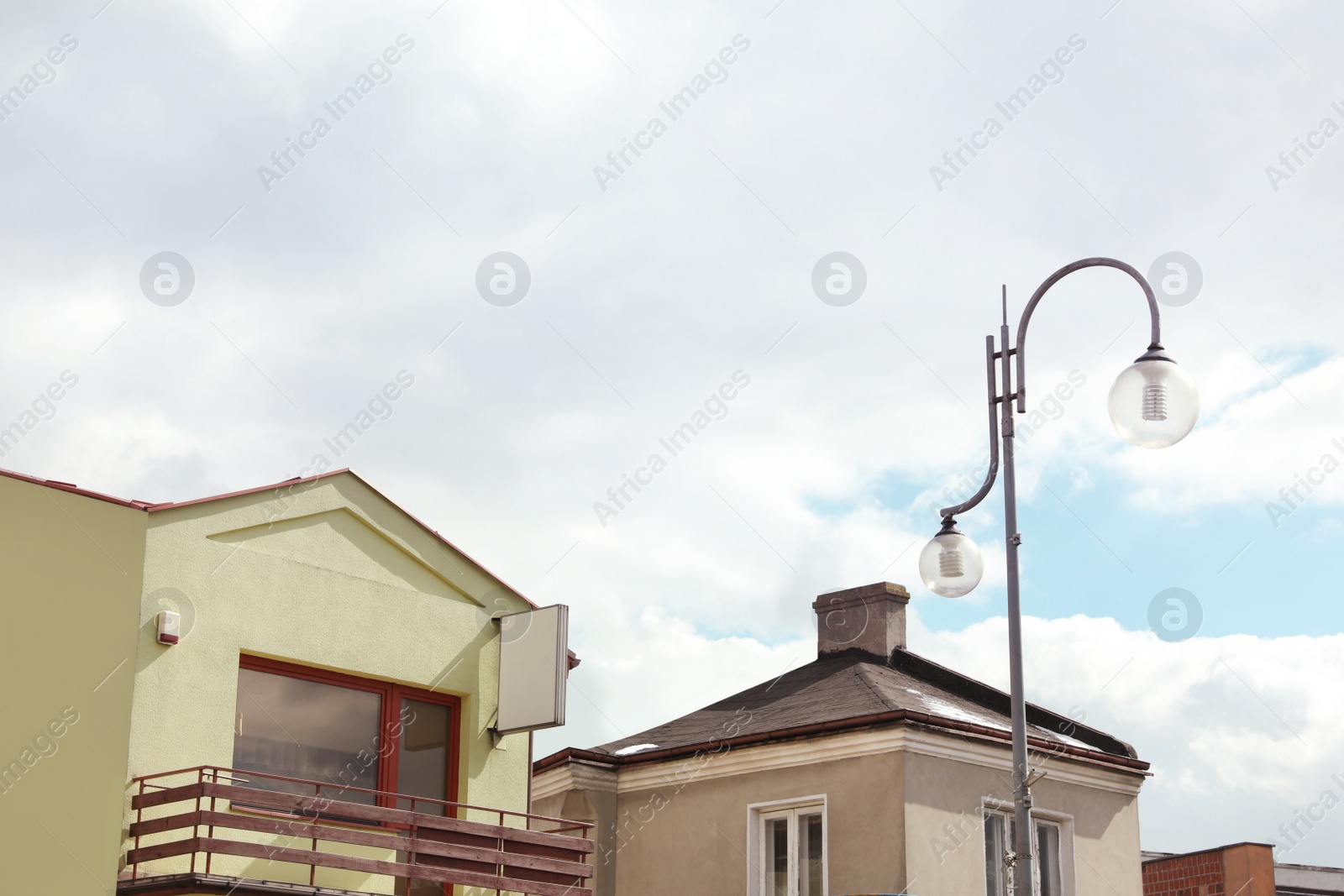 Photo of Beautiful street lamp with glass globes outdoors