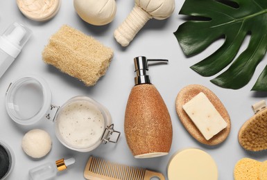 Bath accessories. Flat lay composition with personal care products on light grey background