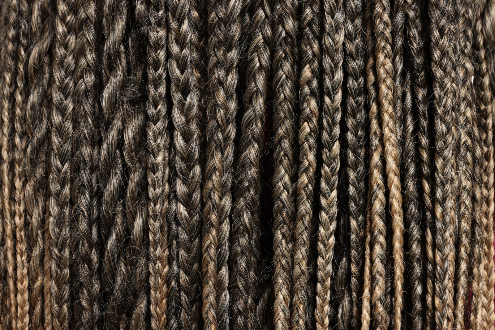 Photo of Many african braids as background, closeup view