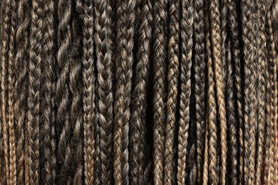 Photo of Many african braids as background, closeup view