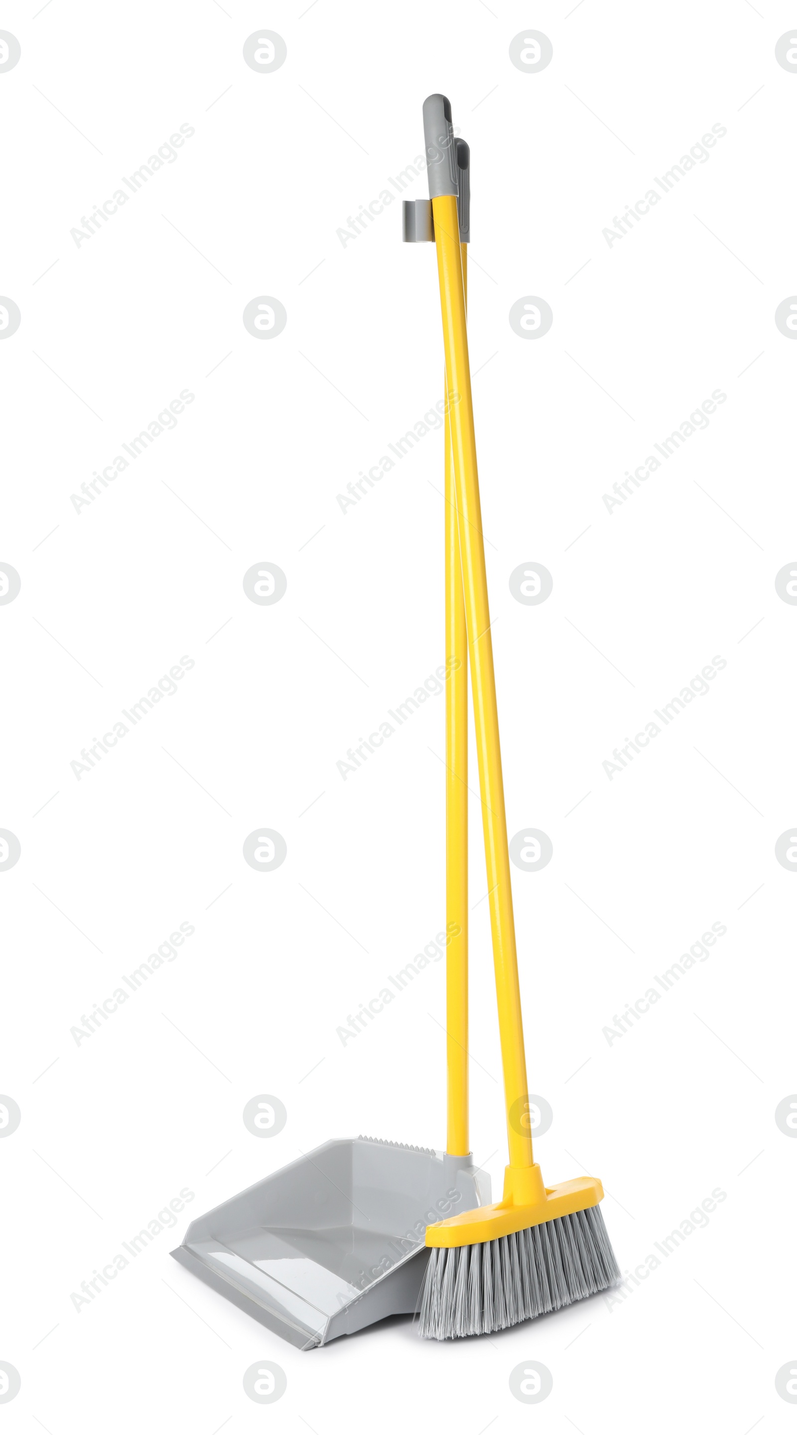 Photo of Plastic broom and dustpan on white background