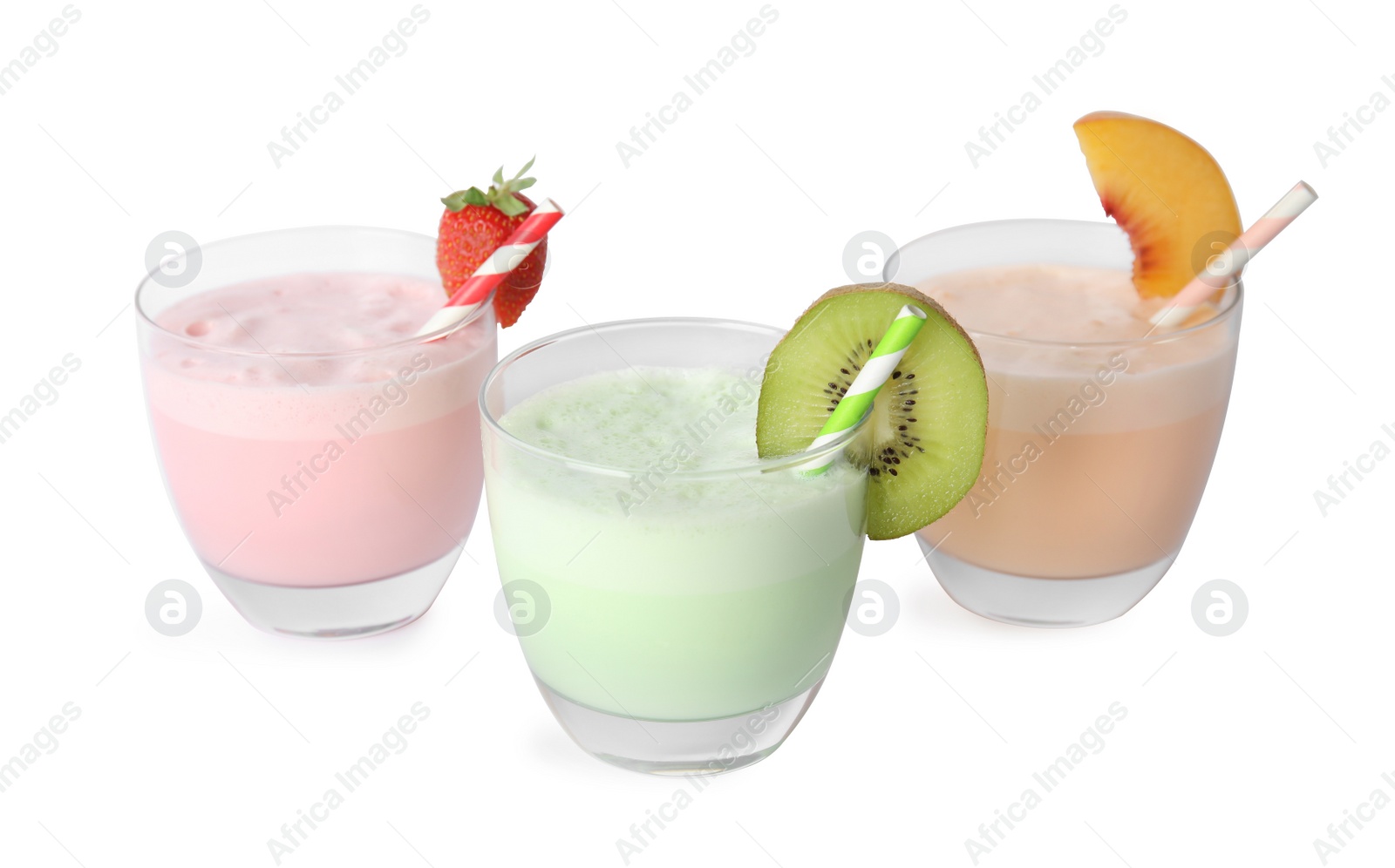 Photo of Glasses of tasty milk shakes on white background