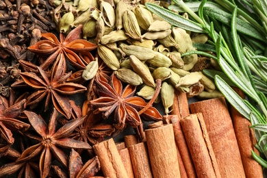 Photo of Different mulled wine ingredients as background, closeup