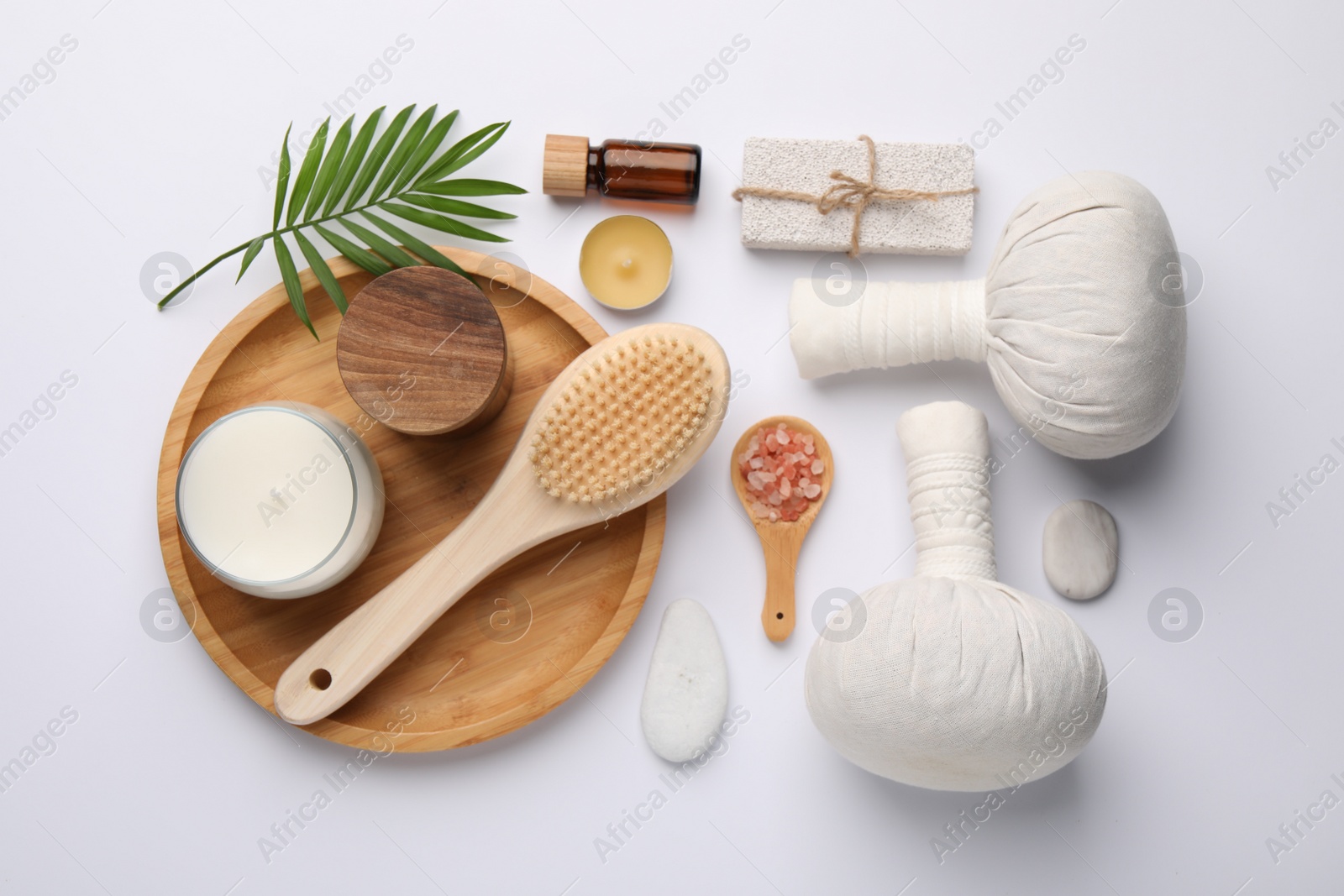 Photo of Flat lay composition with different spa products on white background