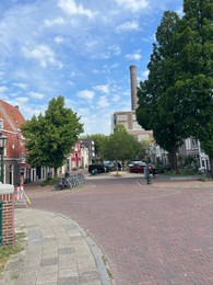 Photo of Leiden, Netherlands - August 28, 2022; Beautiful view of buildings and plants on city street