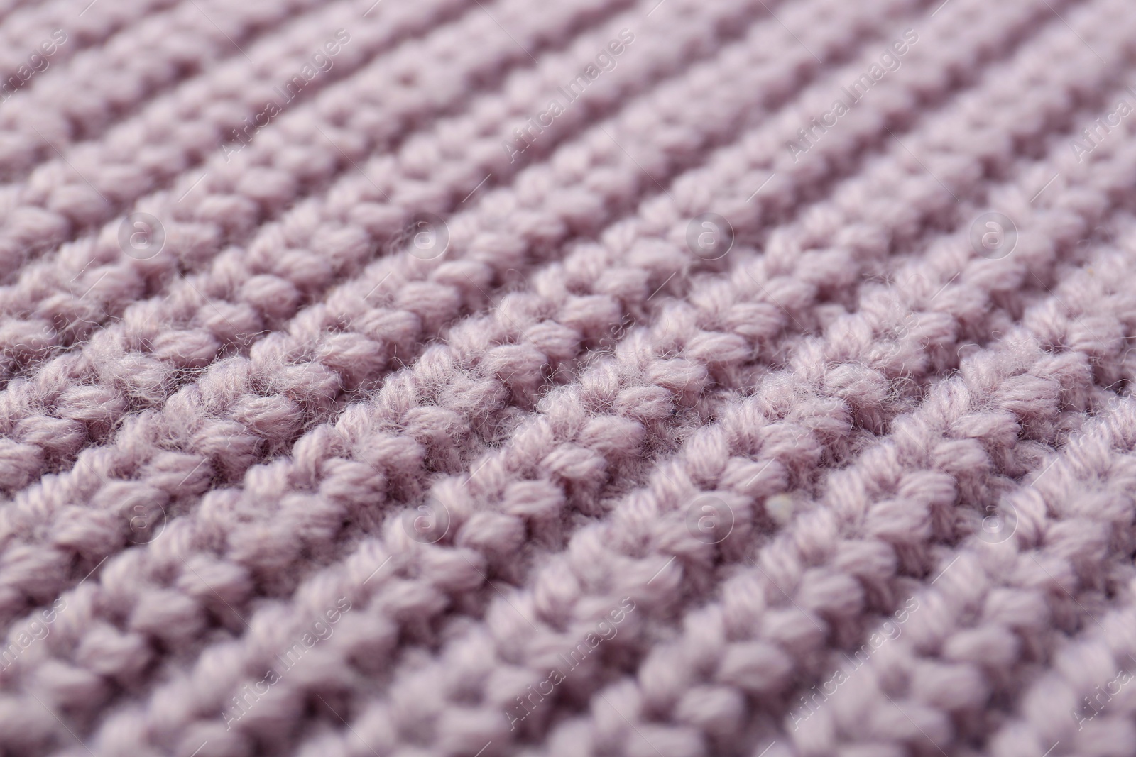 Photo of Beautiful violet knitted fabric as background, closeup