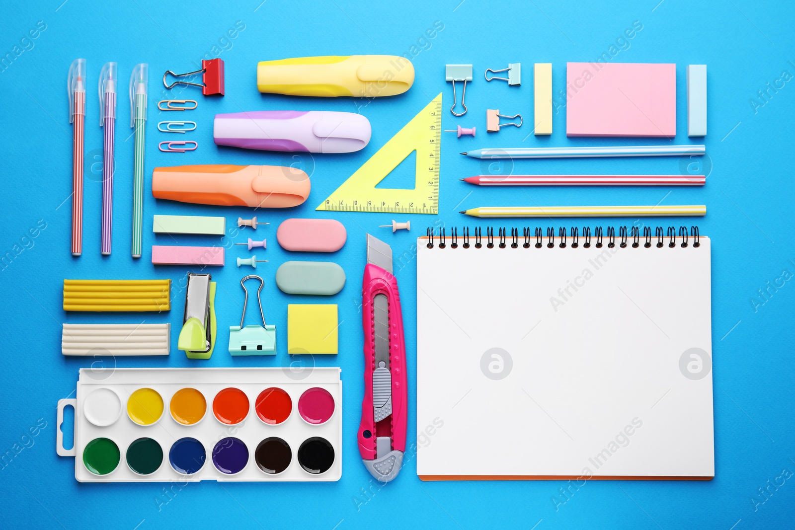 Photo of Different school stationery on light blue background, flat lay. Back to school