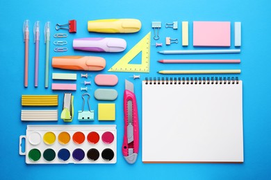 Photo of Different school stationery on light blue background, flat lay. Back to school