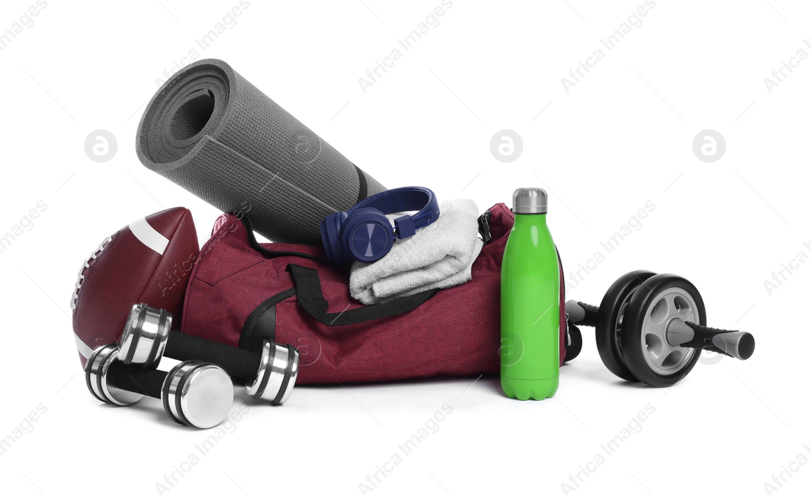 Photo of Gym bag with sports equipment on white background