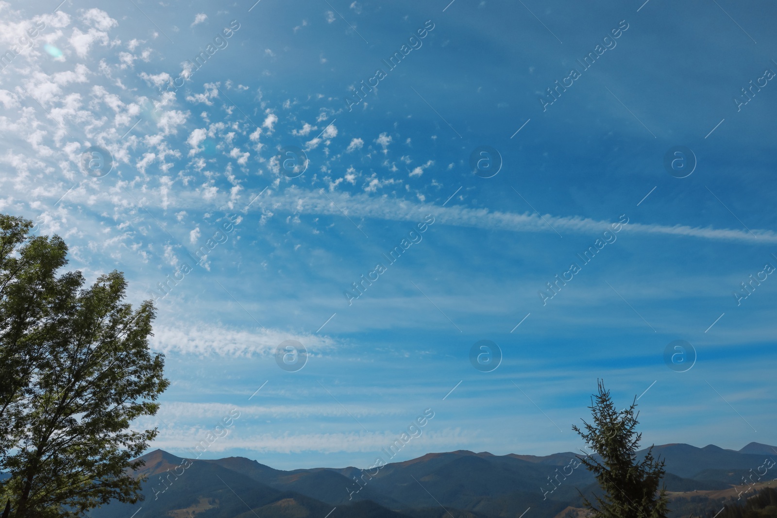 Photo of Picturesque view of blue sky with clouds over mountain landscape