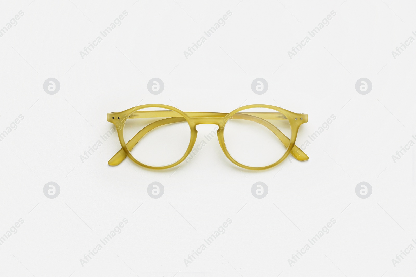 Photo of Glasses with corrective lenses on white background, top view