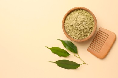 Photo of Henna powder, green leaves and comb on beige background, flat lay with space for text. Natural hair coloring