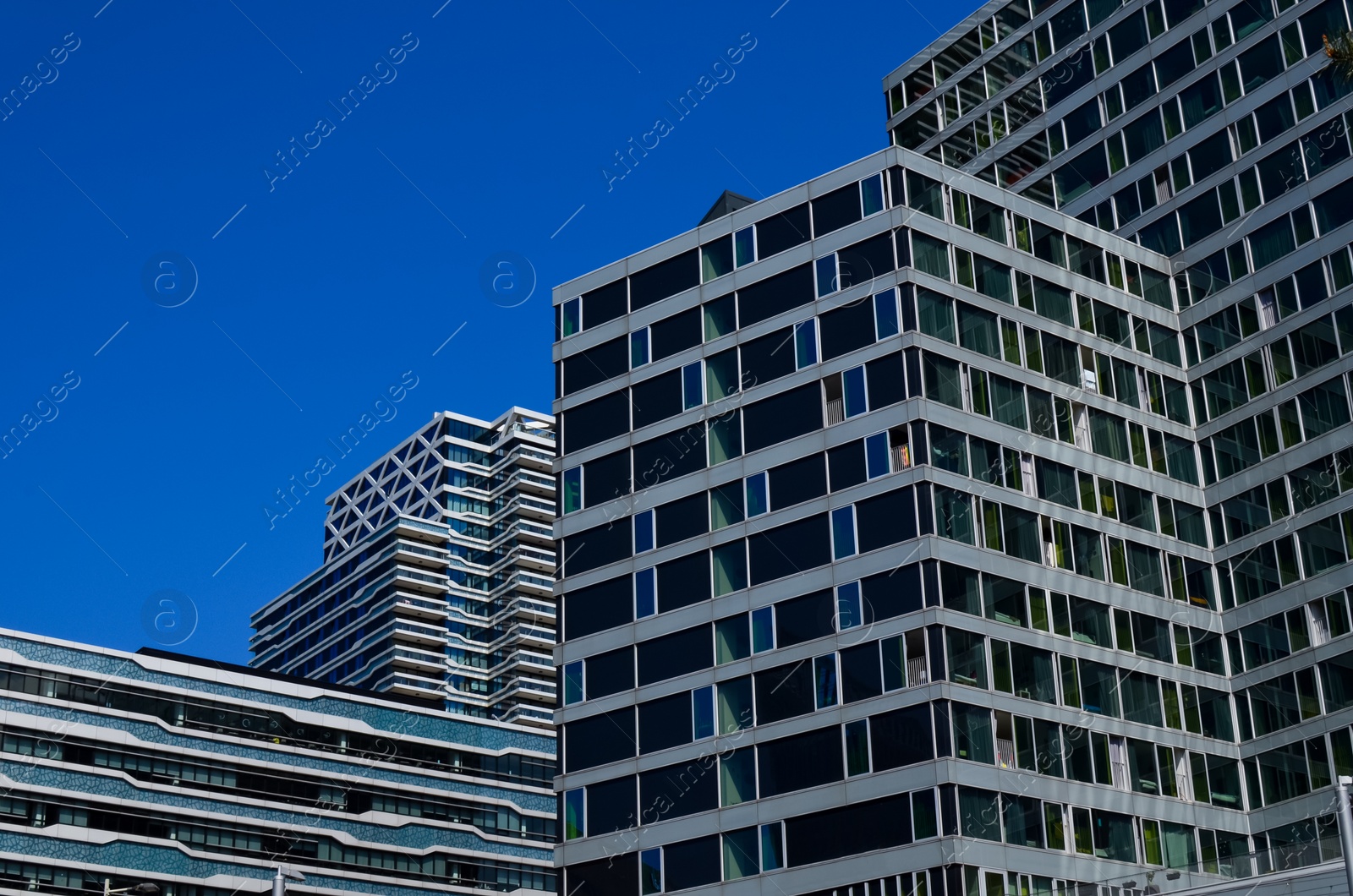 Photo of Exterior of beautiful modern building against blue sky