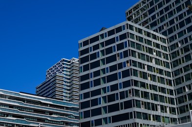 Exterior of beautiful modern building against blue sky