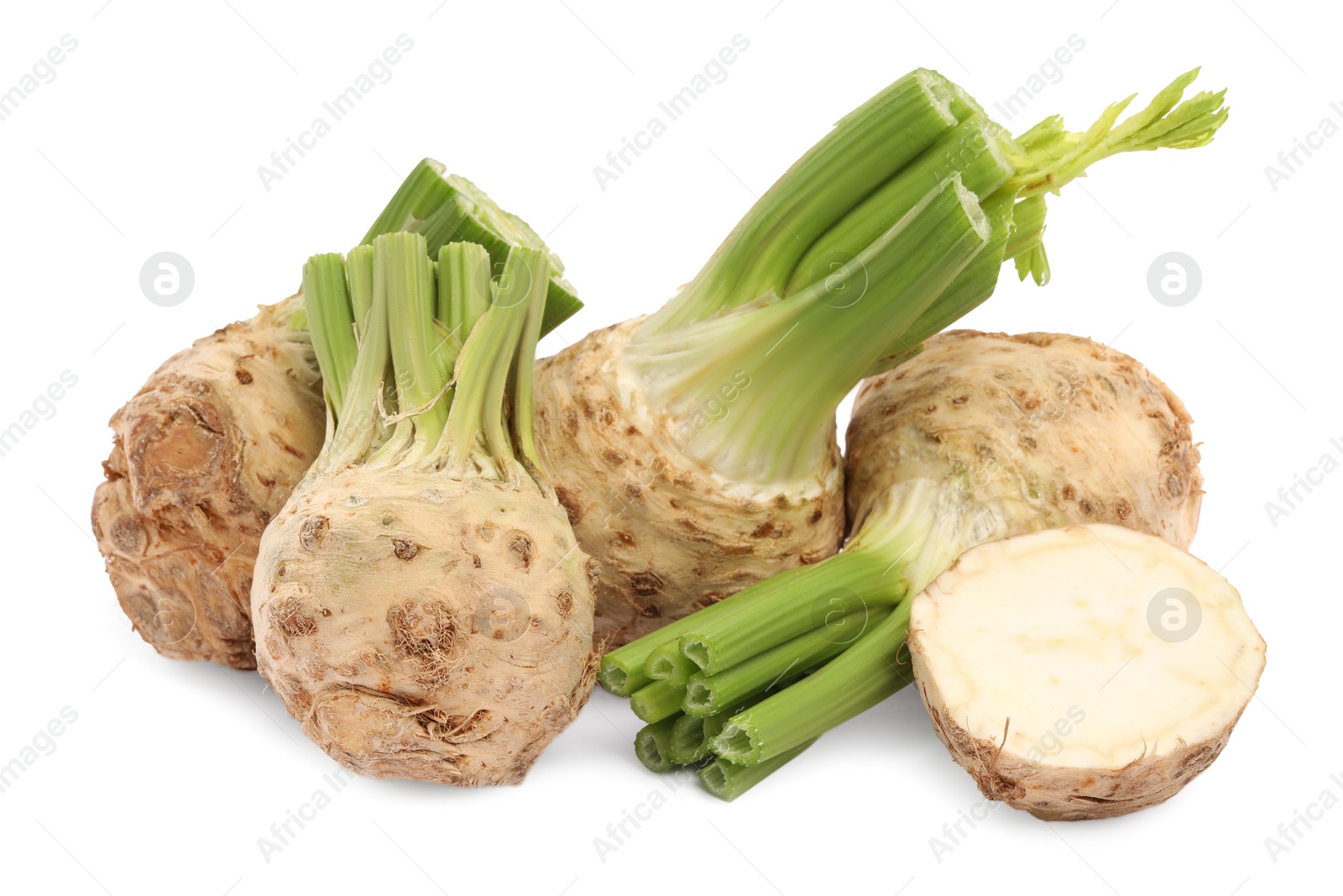 Photo of Whole and cut celery roots isolated on white