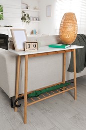 Photo of Living room interior with console table and stylish decor