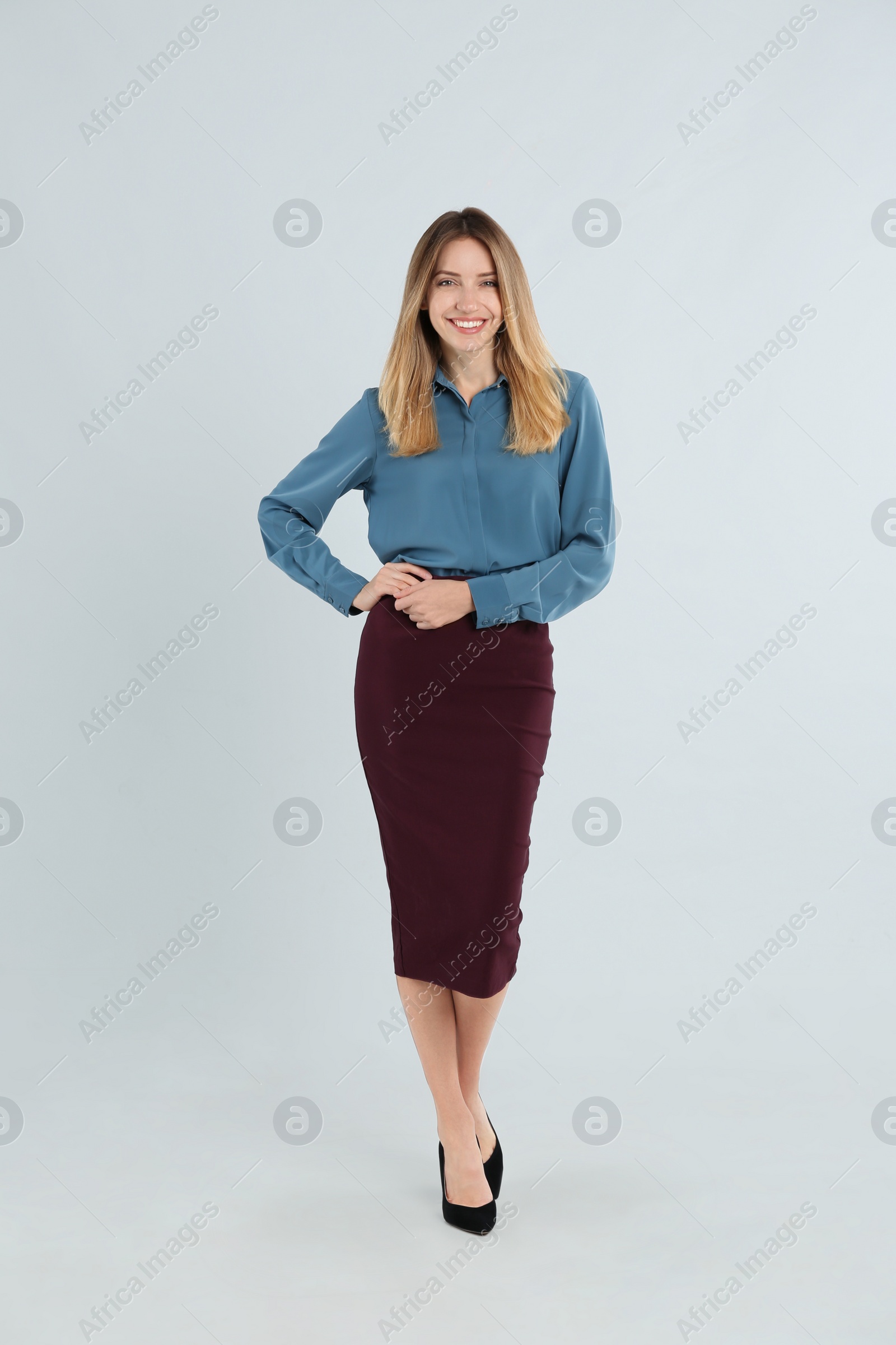 Photo of Full length portrait of beautiful young businesswoman on white background