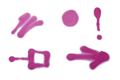 Photo of Symbols drawn by pink spray paint on white background