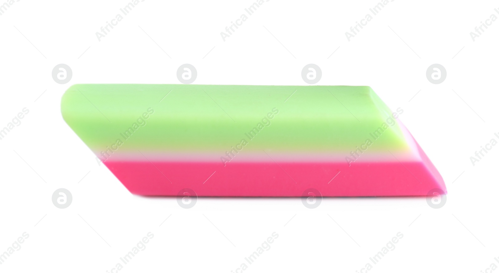 Photo of New bright eraser isolated on white. School stationery