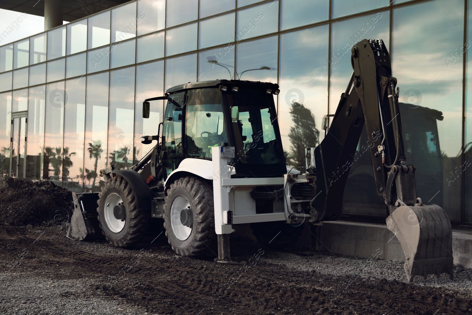 Photo of Modern skid loader on construction site outdoors