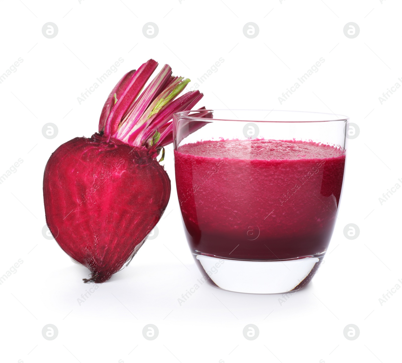 Photo of Glass of beet juice and fresh vegetable on white background