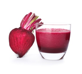 Photo of Glass of beet juice and fresh vegetable on white background