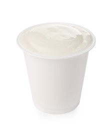 Photo of Delicious organic yogurt in plastic cup isolated on white