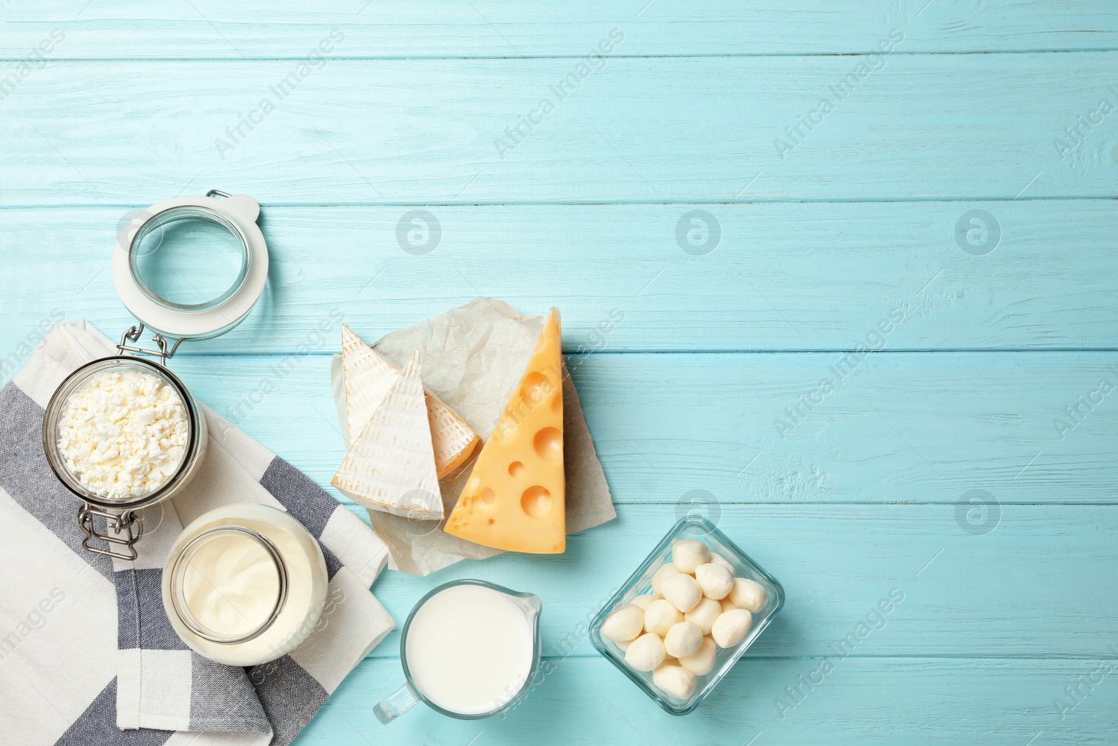 Photo of Flat lay composition with different dairy products on wooden background