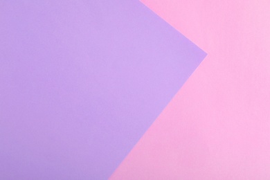 Photo of Violet and pink paper sheets as colorful background, top view