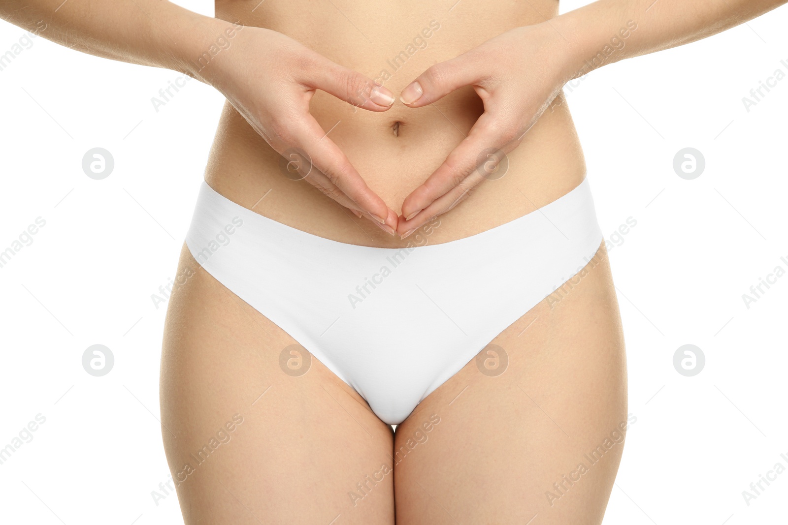 Photo of Gynecology. Woman in underwear making heart with her hands on white background, closeup