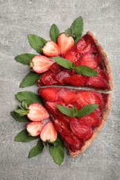 Photo of Pieces of delicious strawberry tart on light grey table, flat lay