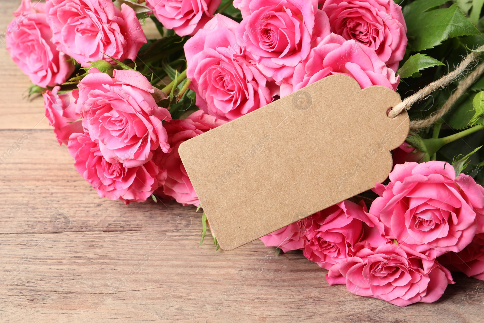 Photo of Happy Mother's Day. Beautiful flowers and blank card on wooden table