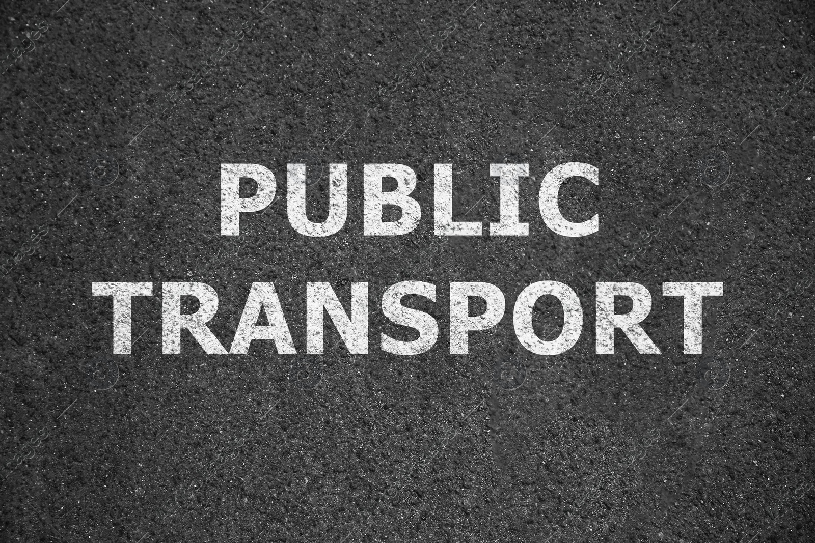 Image of Text PUBLIC TRANSPORT written on asphalt road, top view