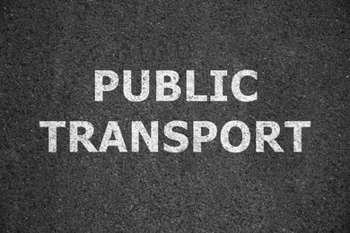 Image of Text PUBLIC TRANSPORT written on asphalt road, top view