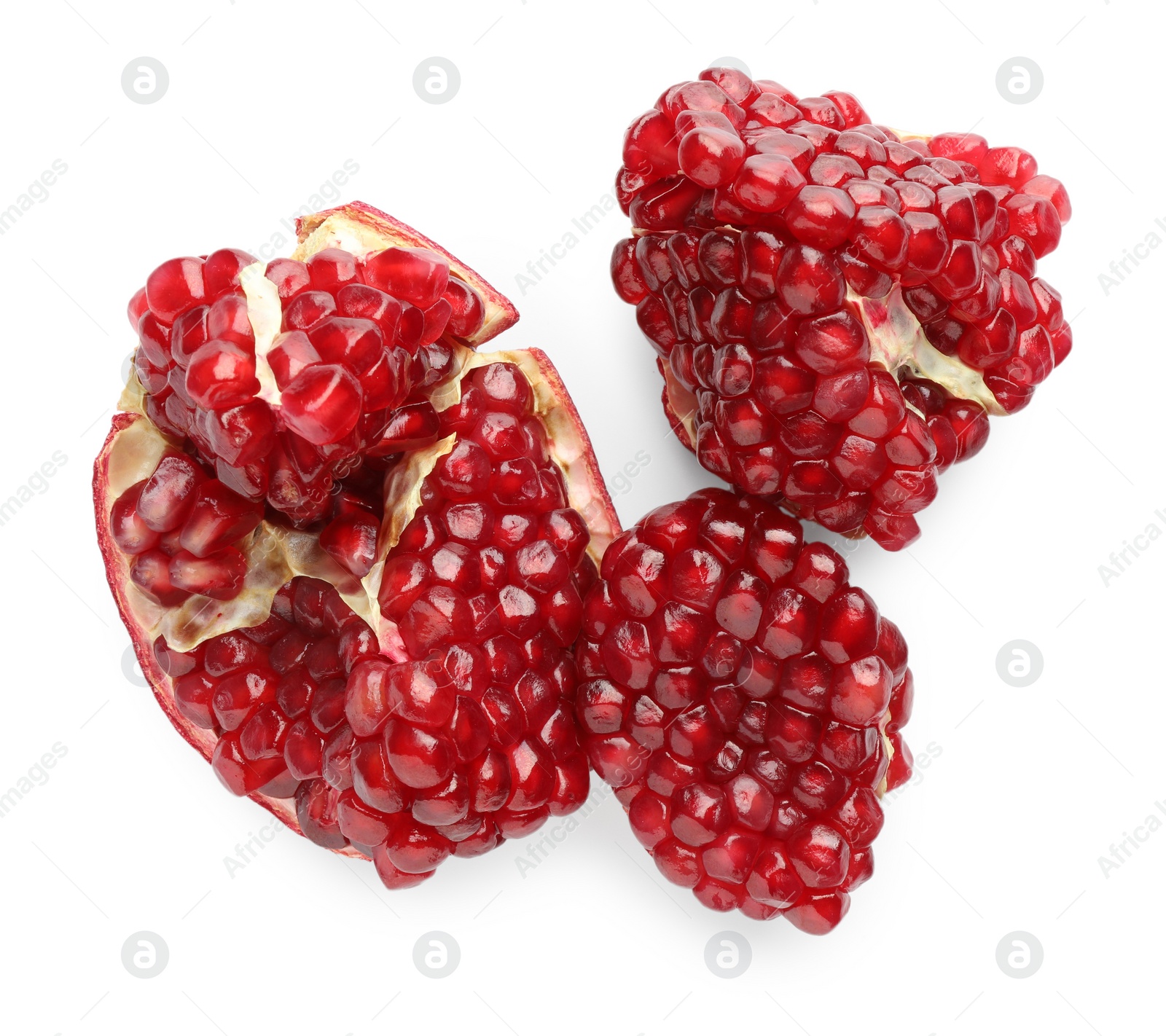 Photo of Fresh cut pomegranate isolated on white, top view