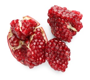 Photo of Fresh cut pomegranate isolated on white, top view