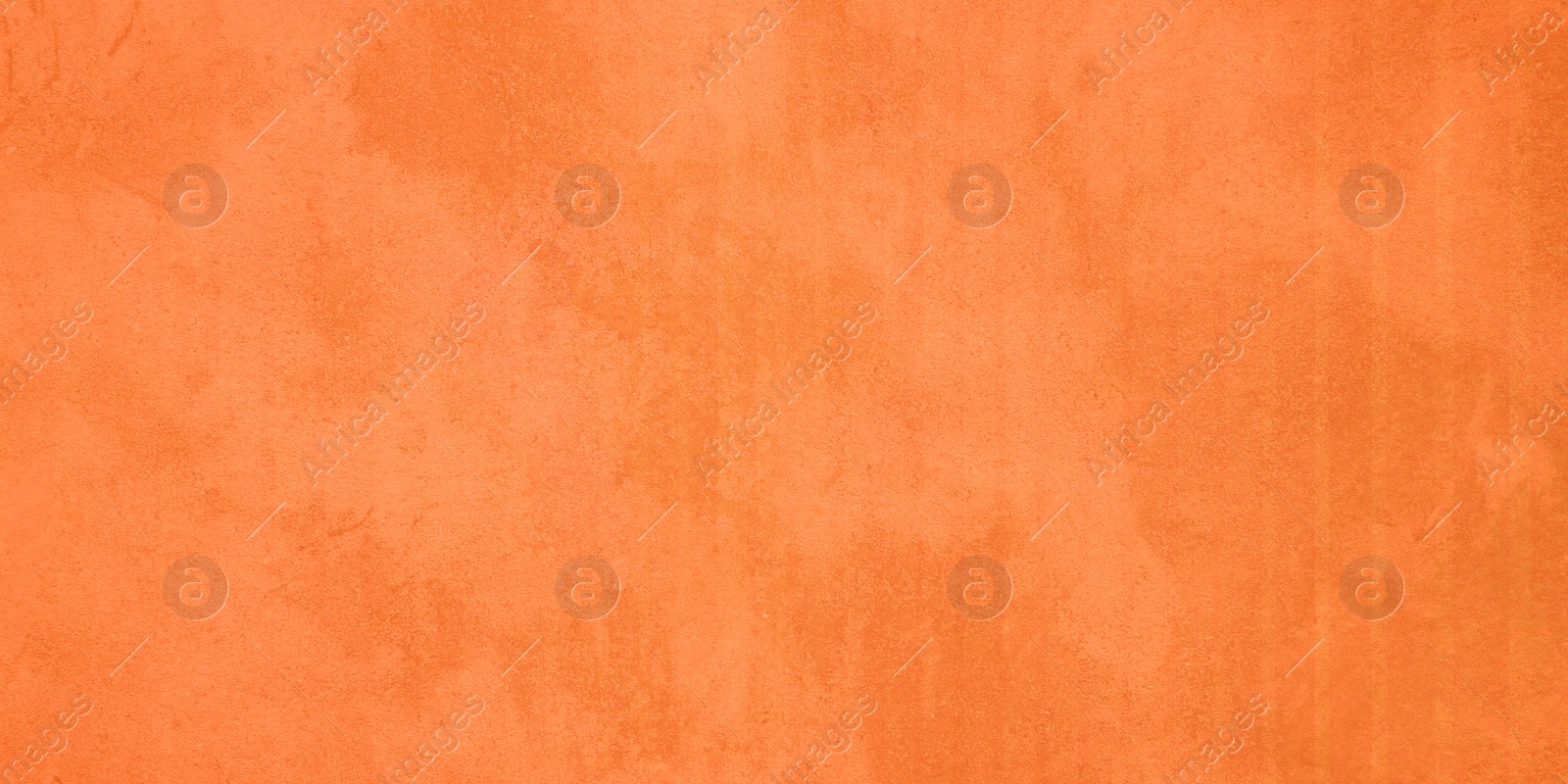 Image of Texture of concrete surface painted in orange color as background