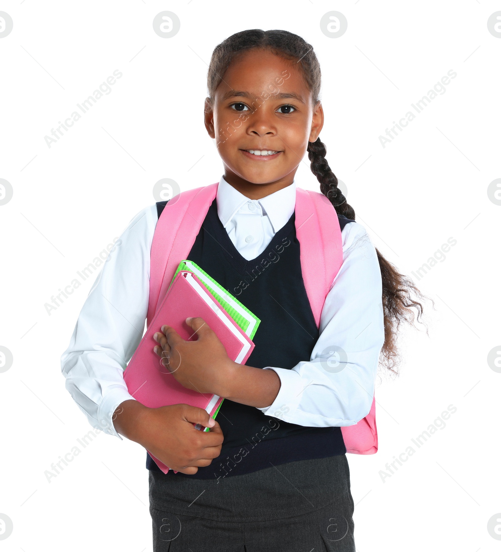 Photo of Happy African-American girl in school uniform on white background