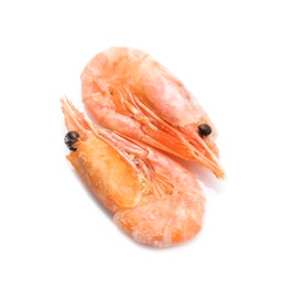 Photo of Raw shrimps covered with ice on white background, top view