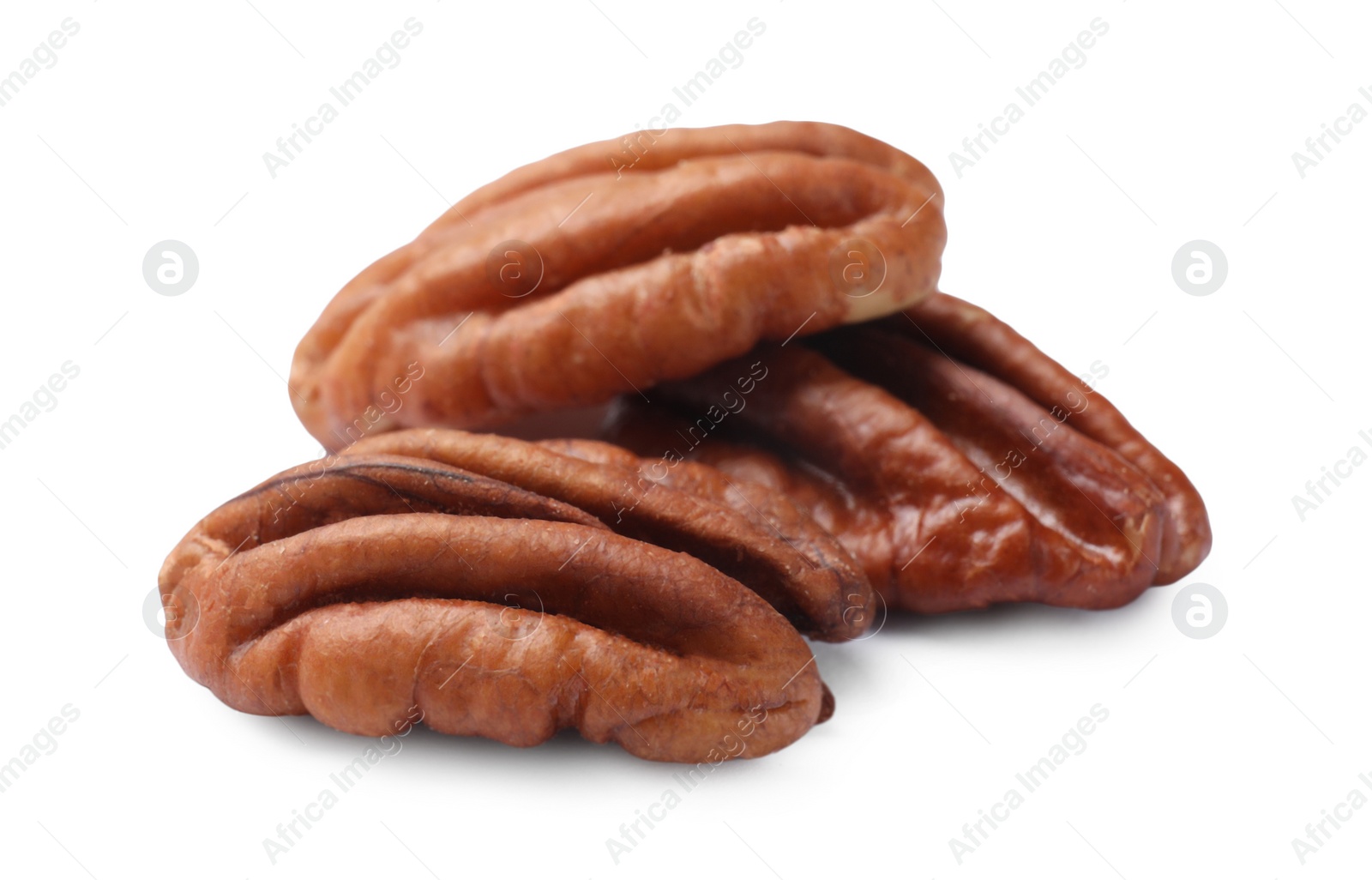 Photo of Three tasty pecan nuts isolated on white