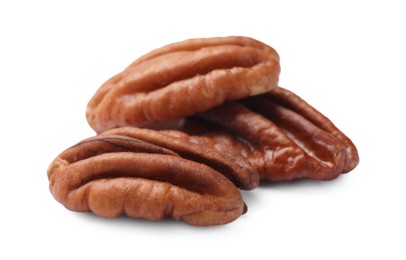 Photo of Three tasty pecan nuts isolated on white