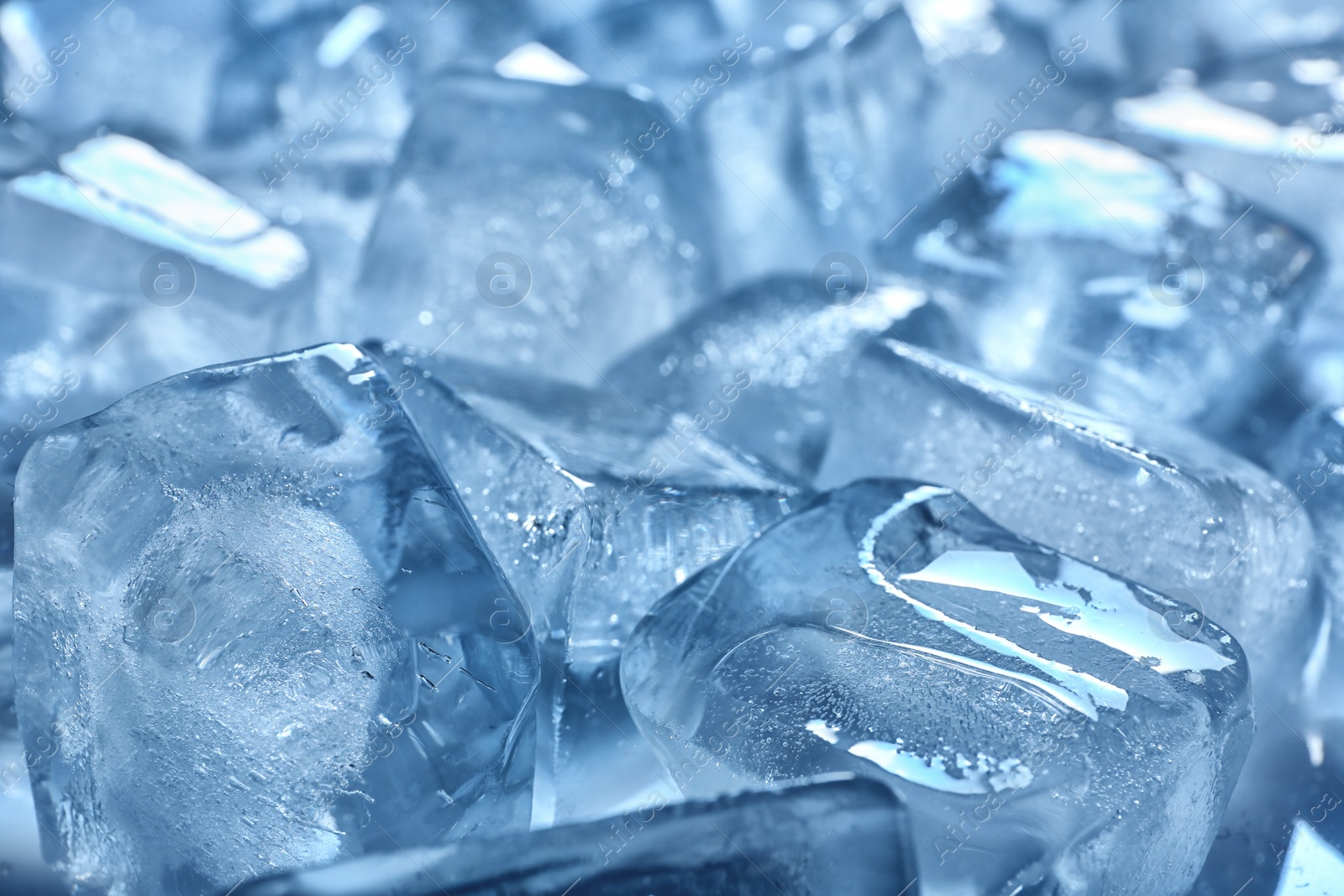 Photo of Pile of transparent ice cubes melting, closeup
