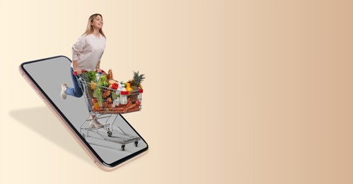 Online purchases. Woman with shopping cart full of different products running out from smartphone on beige background. Banner design with space for text