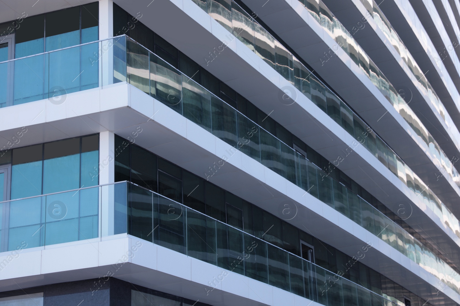 Photo of Exterior of residential building with balconies, low angle view