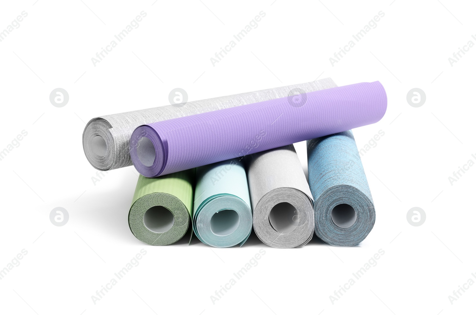 Photo of Many different wallpaper rolls isolated on white